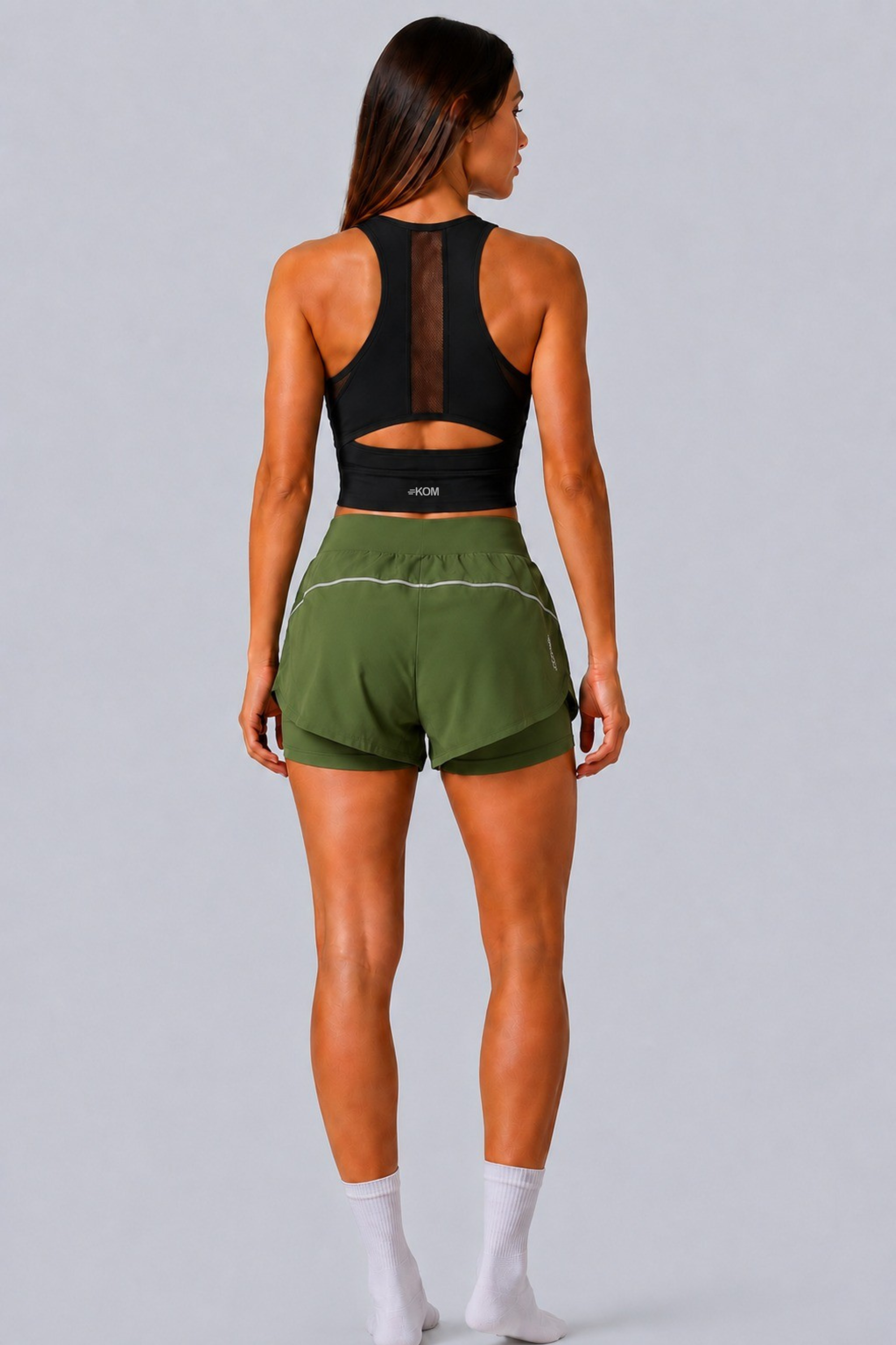 Short Running Deportivo Mujer Línea Giro PLUS con Boxer Interno y Bolsillos