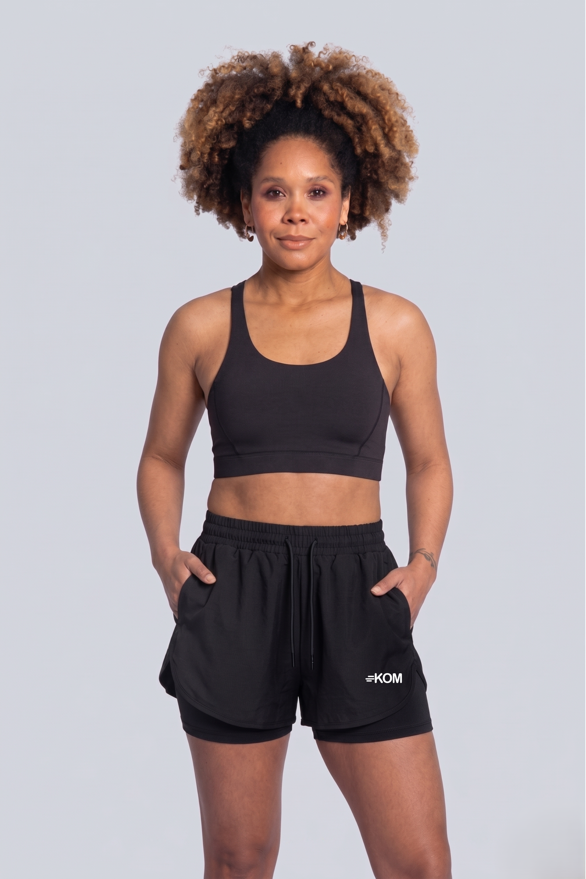 Short Running Deportivo Mujer Línea Giro con Boxer Interno y Bolsillos