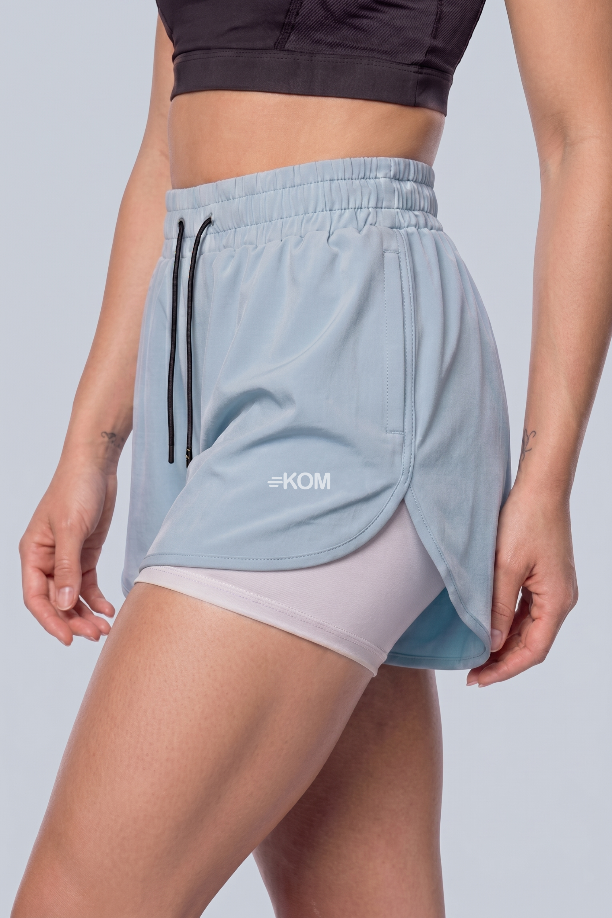 Short Running Deportivo Mujer Línea Giro con Boxer Interno y Bolsillos
