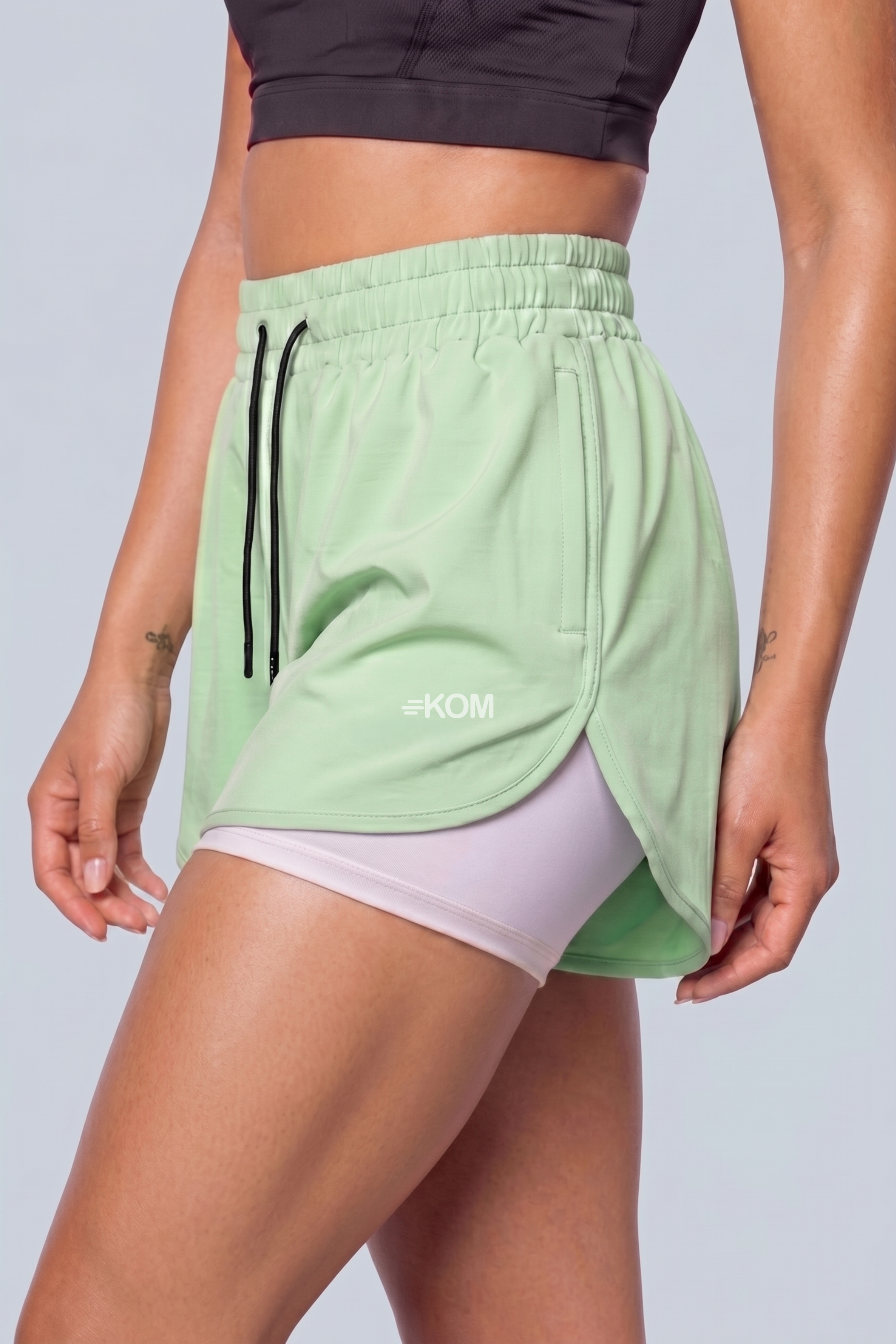 Short Running Deportivo Mujer Línea Giro con Boxer Interno y Bolsillos